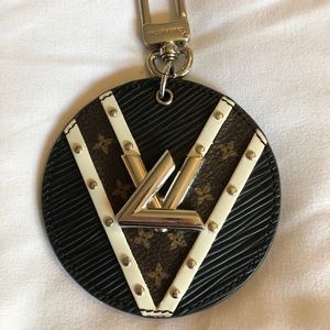 Louis Vuitton leather and metal bag charm